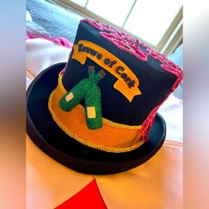 Custom made “Krewe of Cork” top hat w/ Krewe design. Worn once during parade ‘24